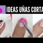 Nail art con adornos y brillos para uñas cortas